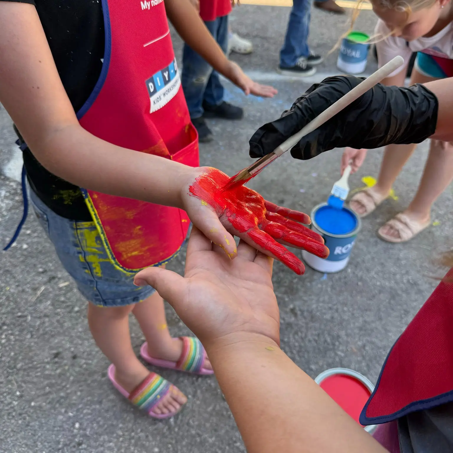 Superior Siding Employees Painting Childrens Hands for Garden Boxes