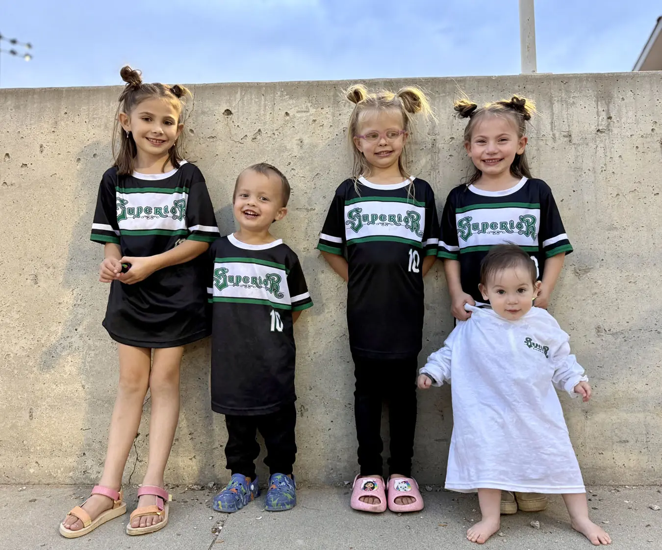 Young fans of softball in Superior Siding gear