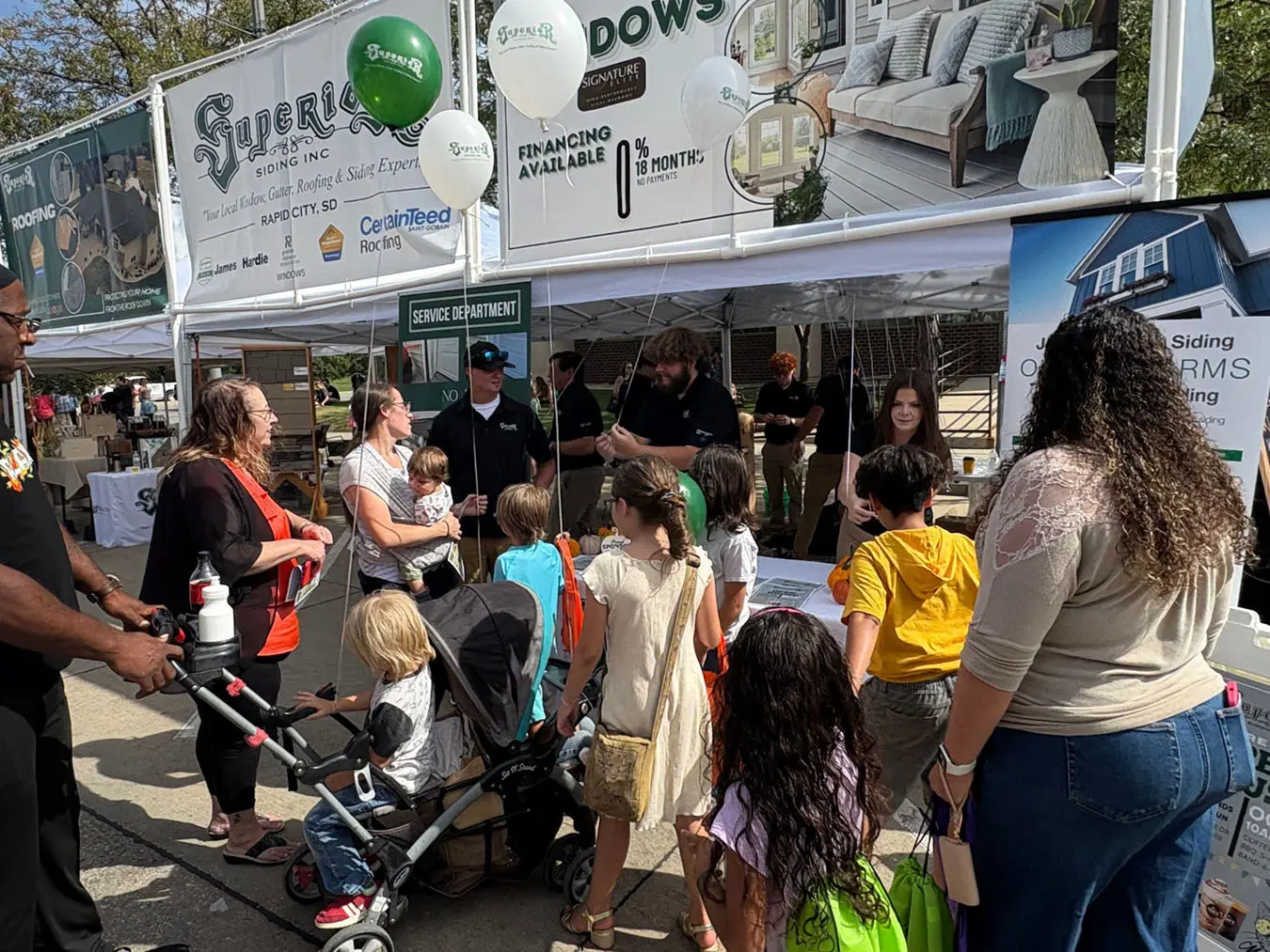 The Superior Siding Team handing out Balloons at the pumpkin festival