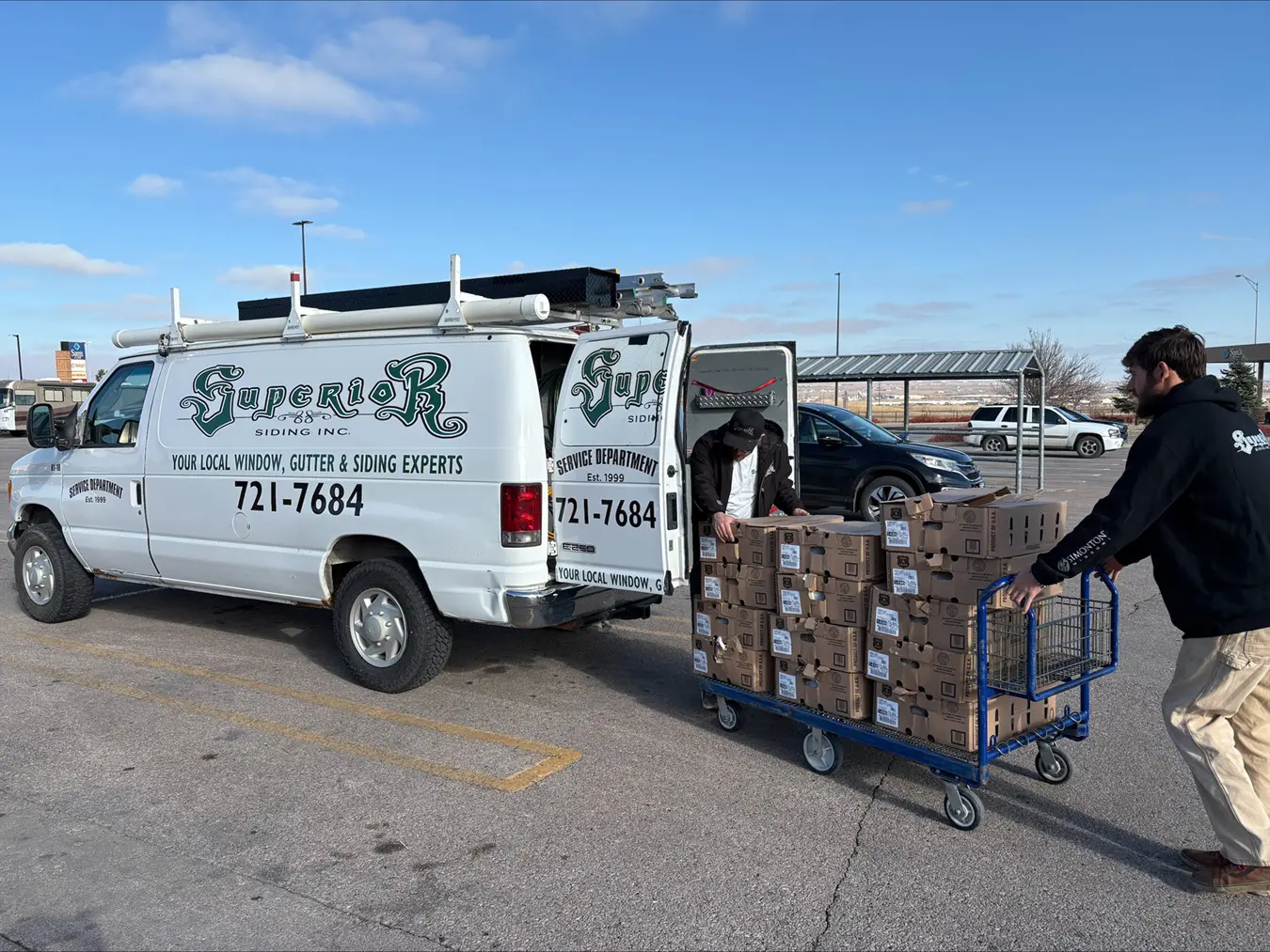Superior Siding Employees Loading up Turkeys to Donate