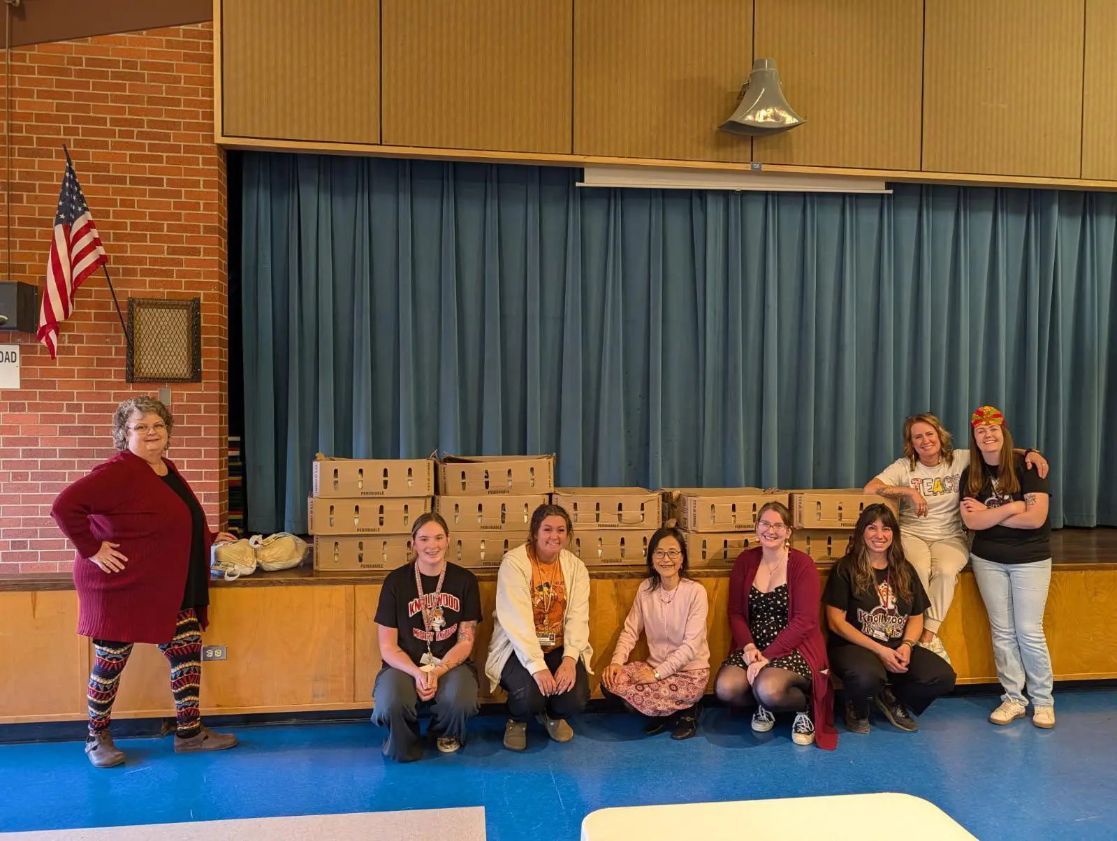 Teachers posing with donated Turkeys