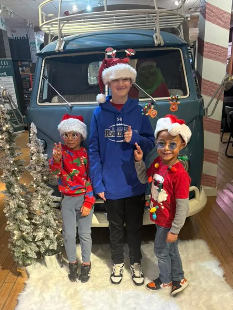 Kids Take a Fun Family Photo in front of the Superior Siding VW Van