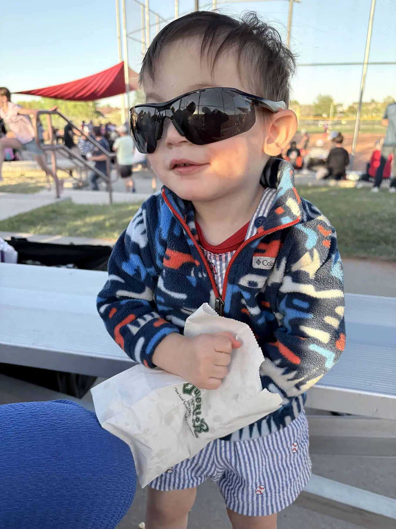Kid with Superior Siding Popcorn Bag at Little League Game in Rapid City