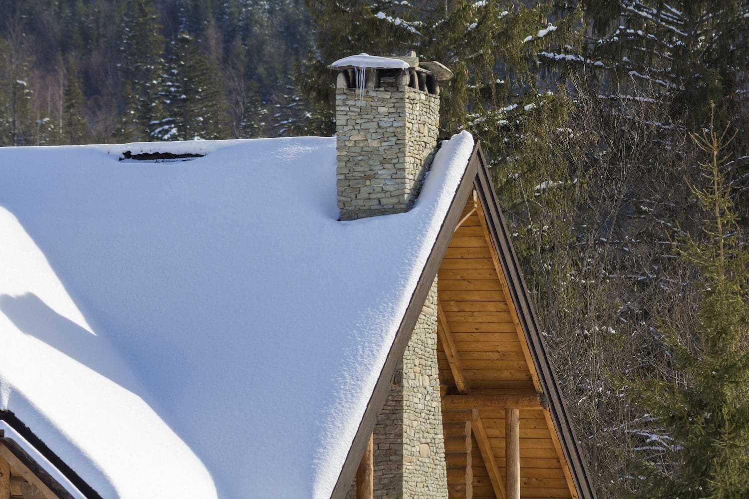 Fresh snow on the roof of a house