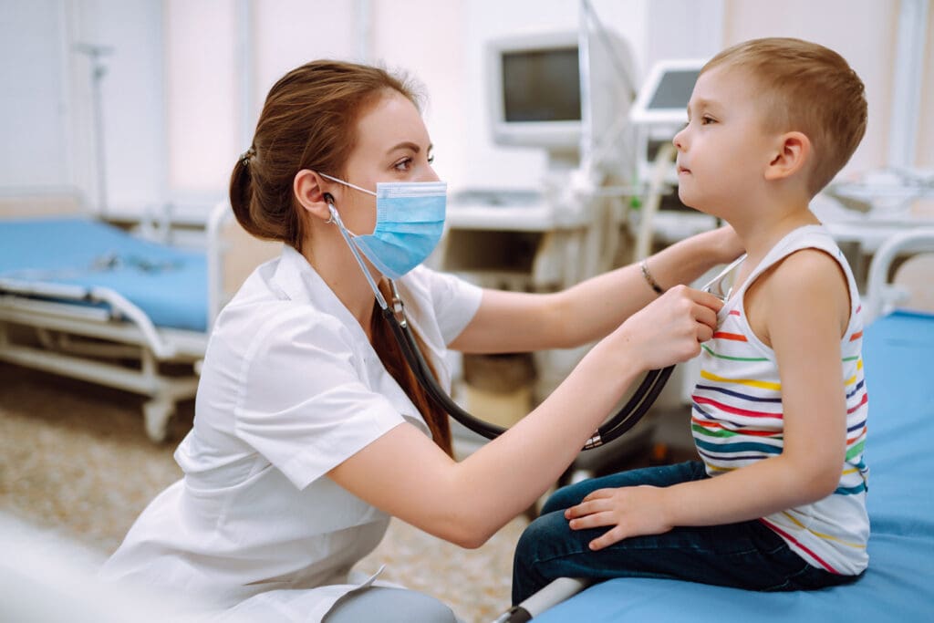 Doctor-Examing-Young-Child-During-Medical-Exam