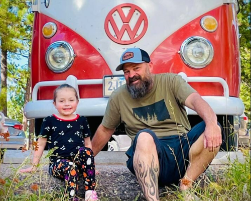 Owner Chad Roth and his child posing for a photo.