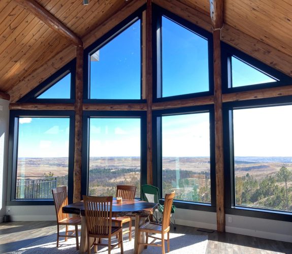 Large windows overlooking view of the Black Hills